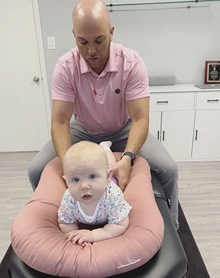 Chiropractor Lexington NC Tony Vizzini Adjusting Baby
